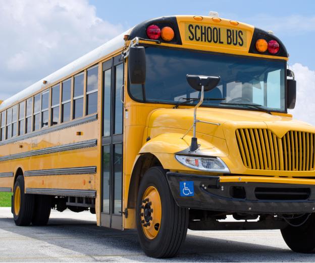 Auxilio school bus on a district route